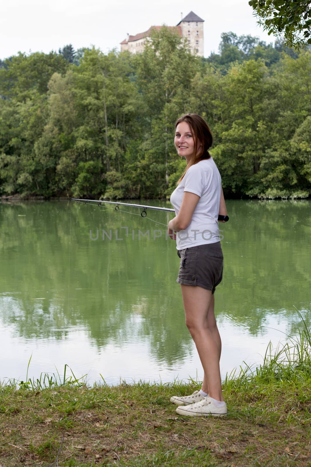 Woman Fishing at a lake by dwaschnig_photo
