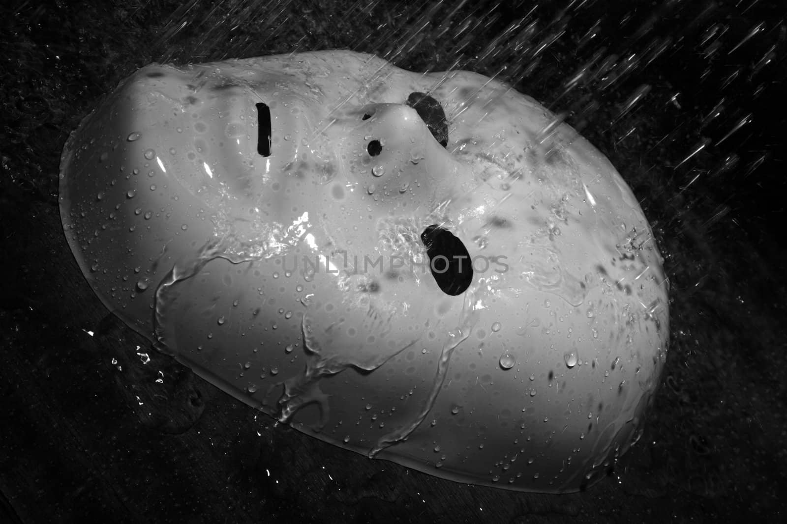 White plastic mask under the rain. Natural light and colors