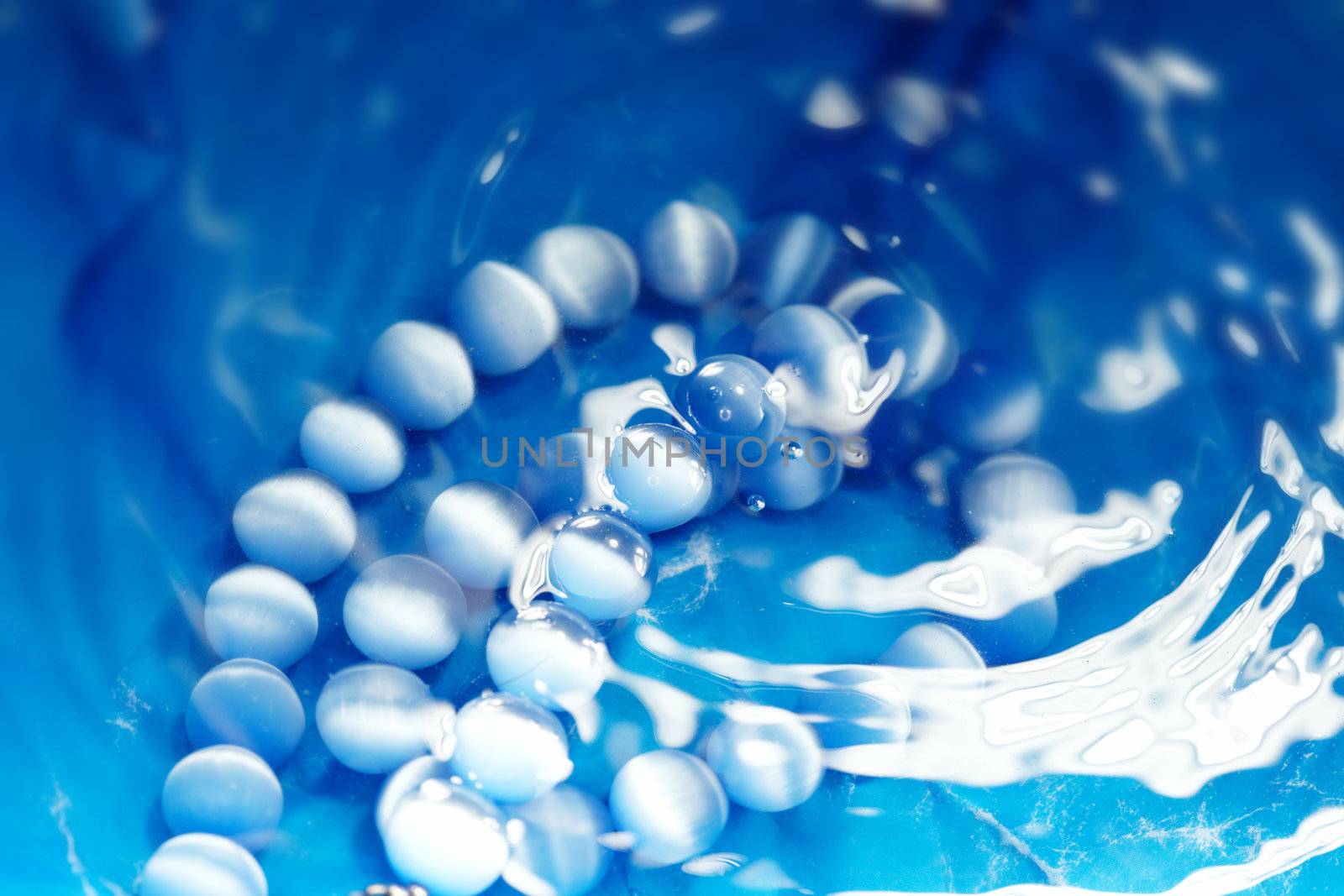 Pearl beads under the water. Close-up photo