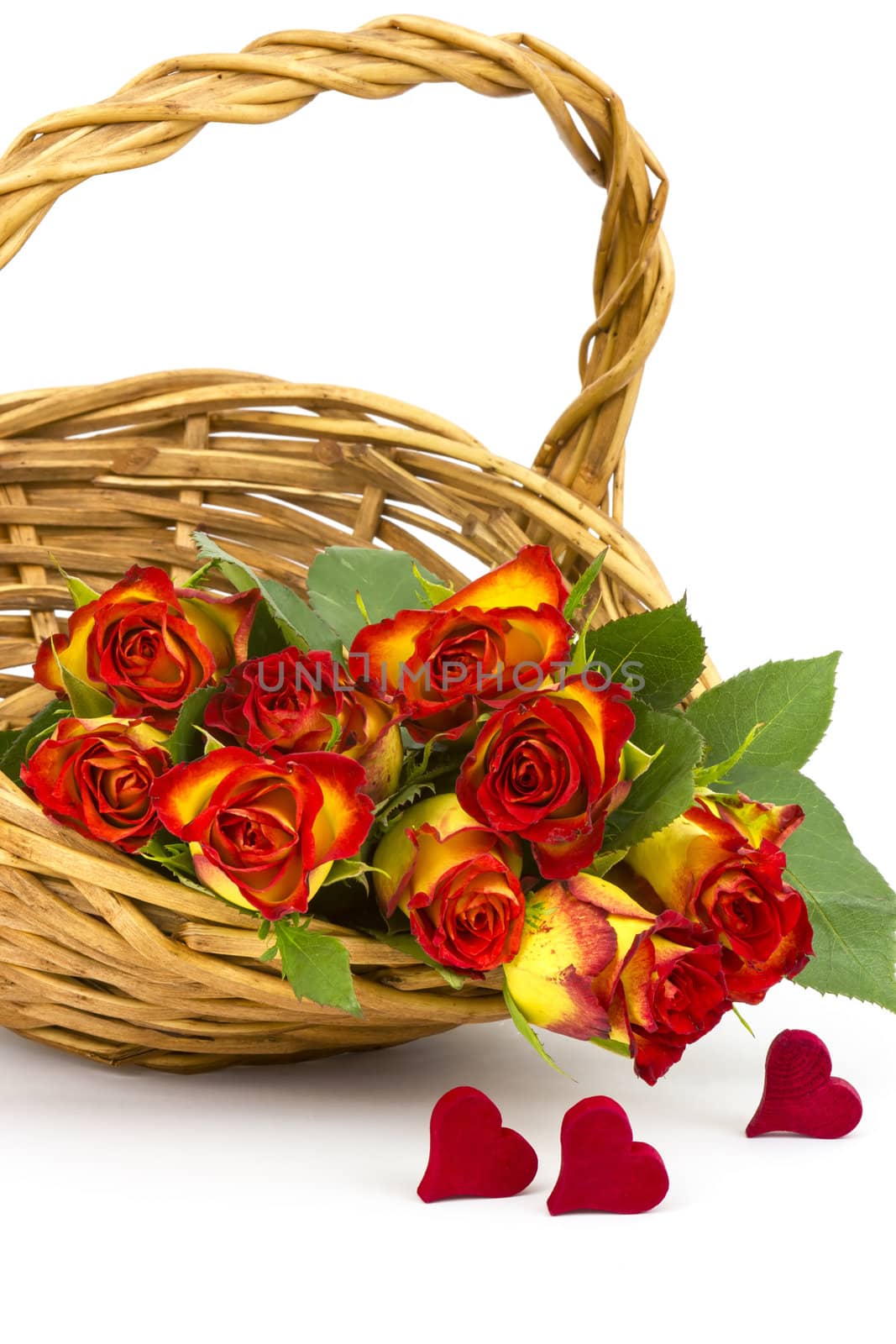 red and yellow roses in a basket