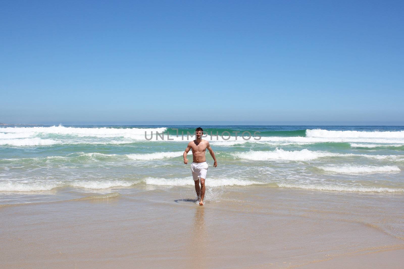 Man running out of indian ocean in south africa