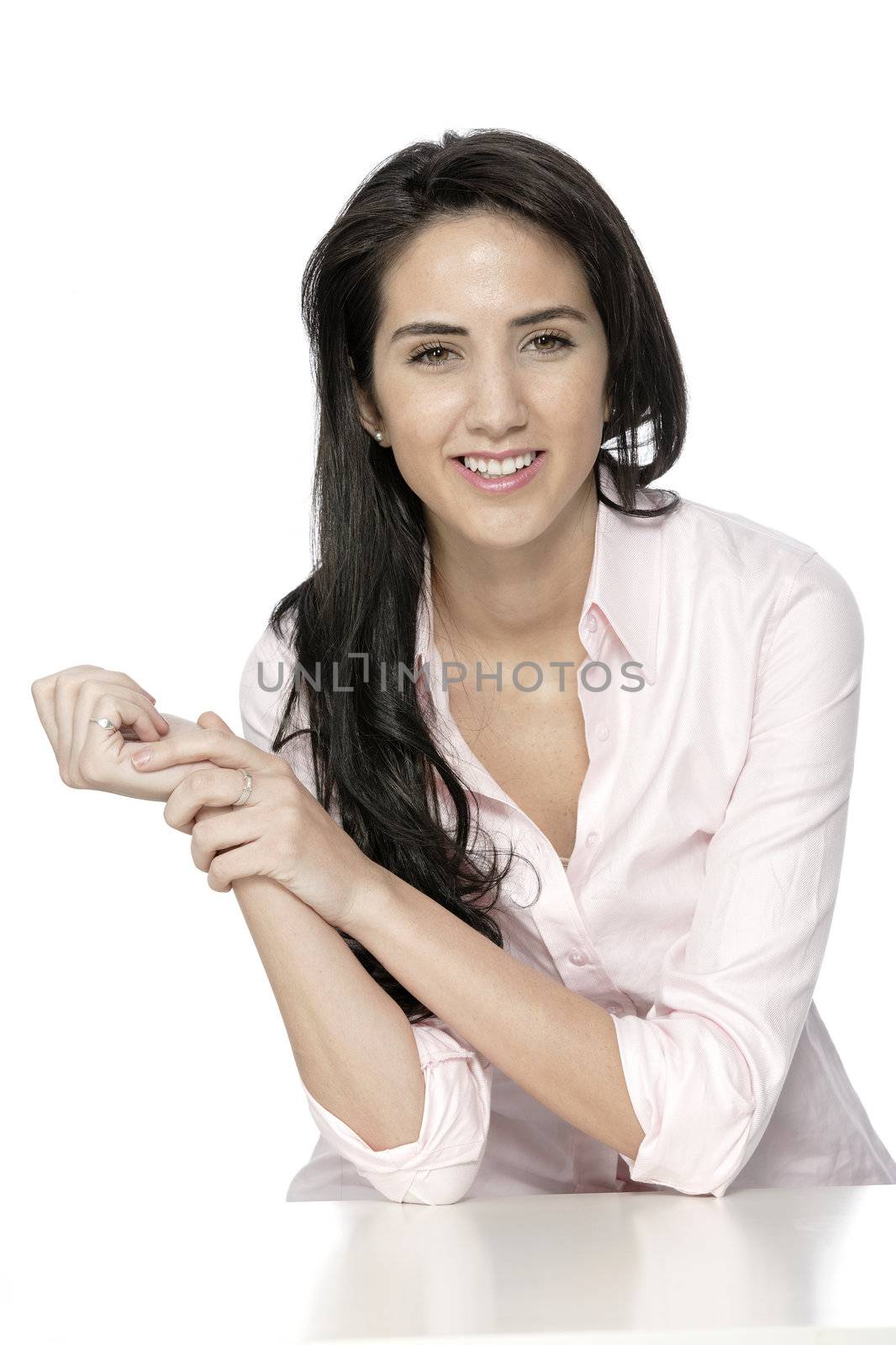 Attractive woman in shirt sat at white table smiling