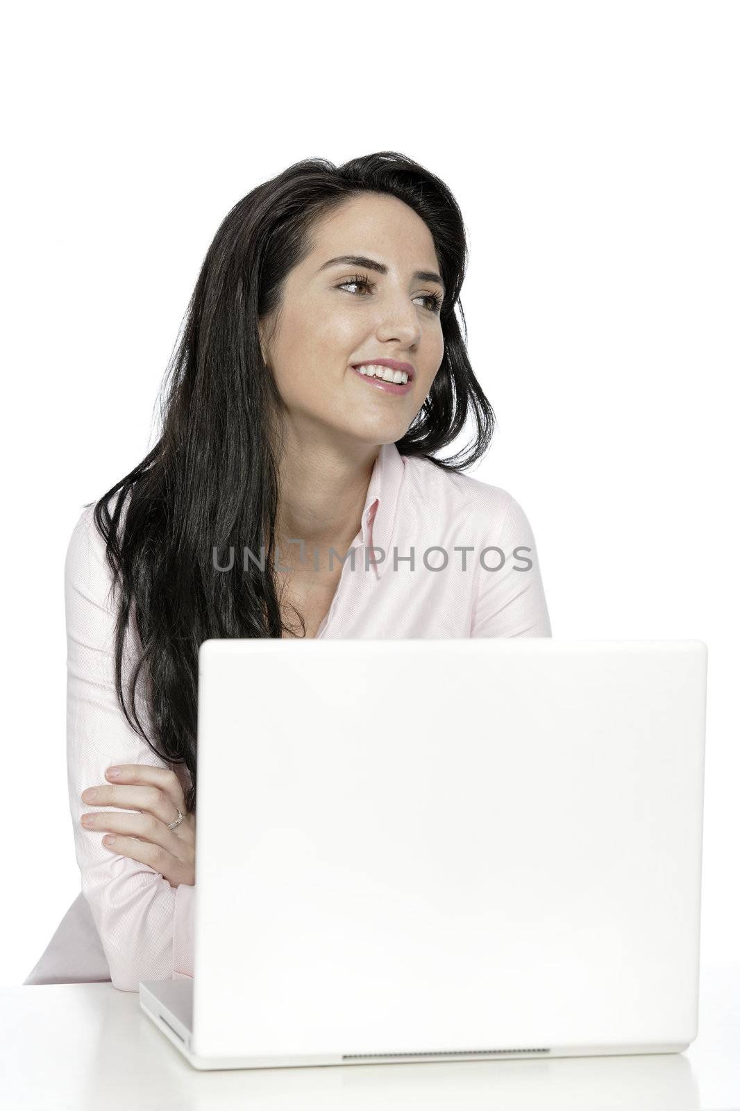 Beautiful young woman sat at white table with her laptop computer