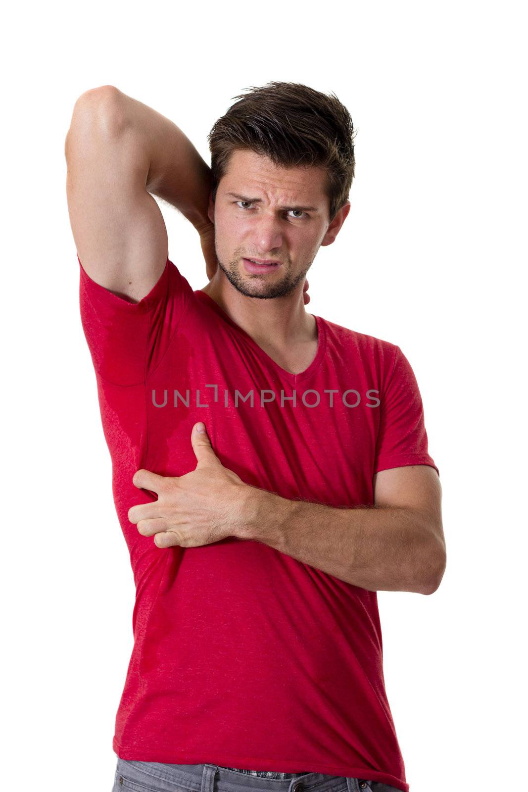 Man sweating very badly under armpit and pointing there by dwaschnig_photo