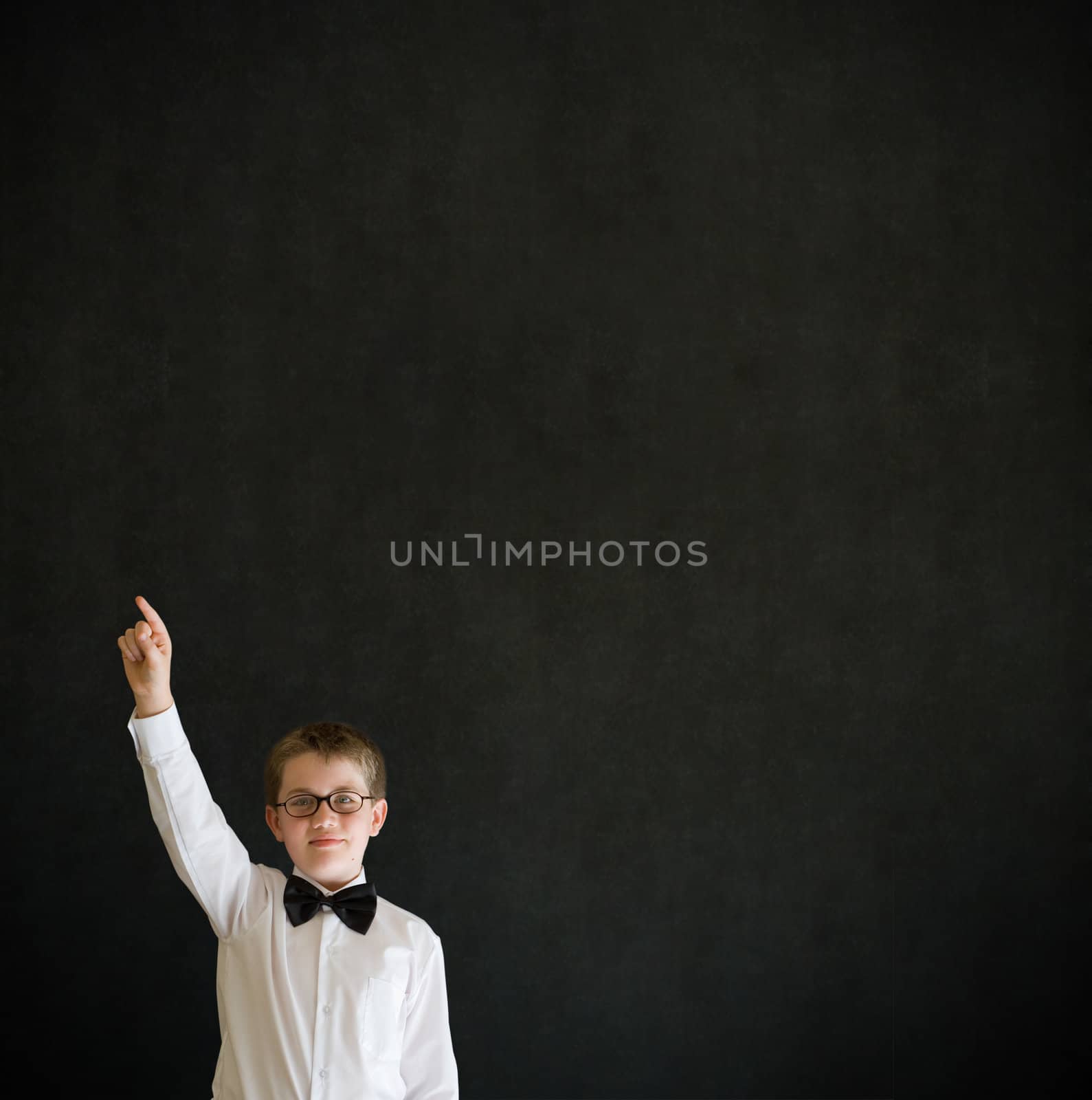 School boy hands up answering question by alistaircotton