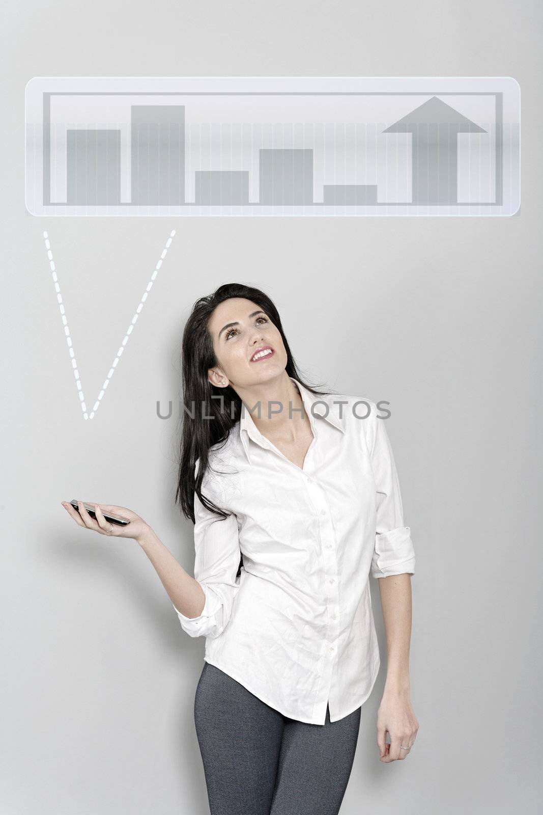 Woman holding out her mobile phone which is displaying graphs and charts