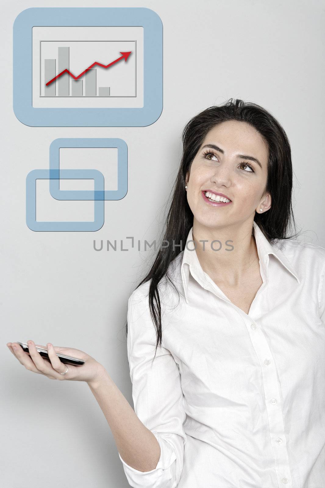 Woman holding out her mobile phone which is displaying a positive increase in the form of a chart