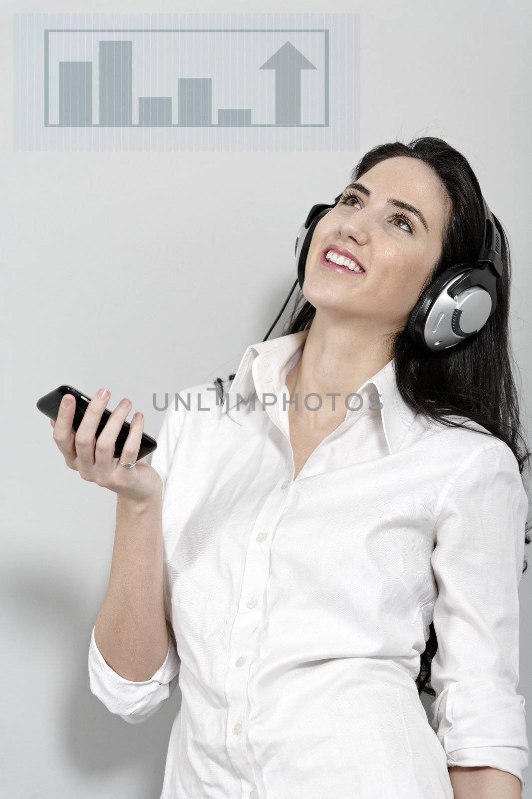 Woman holing out phone displaying volume by studiofi