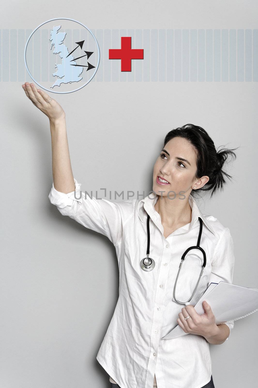 Beautiful female doctor holding a concept red cross button