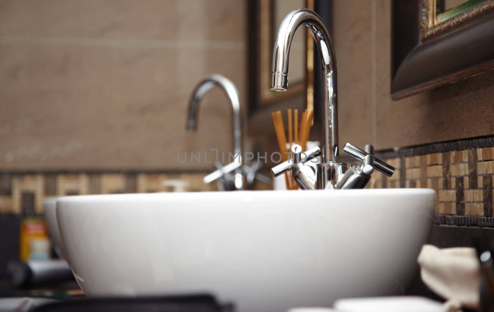 Close-up photo of chrome sink with taps