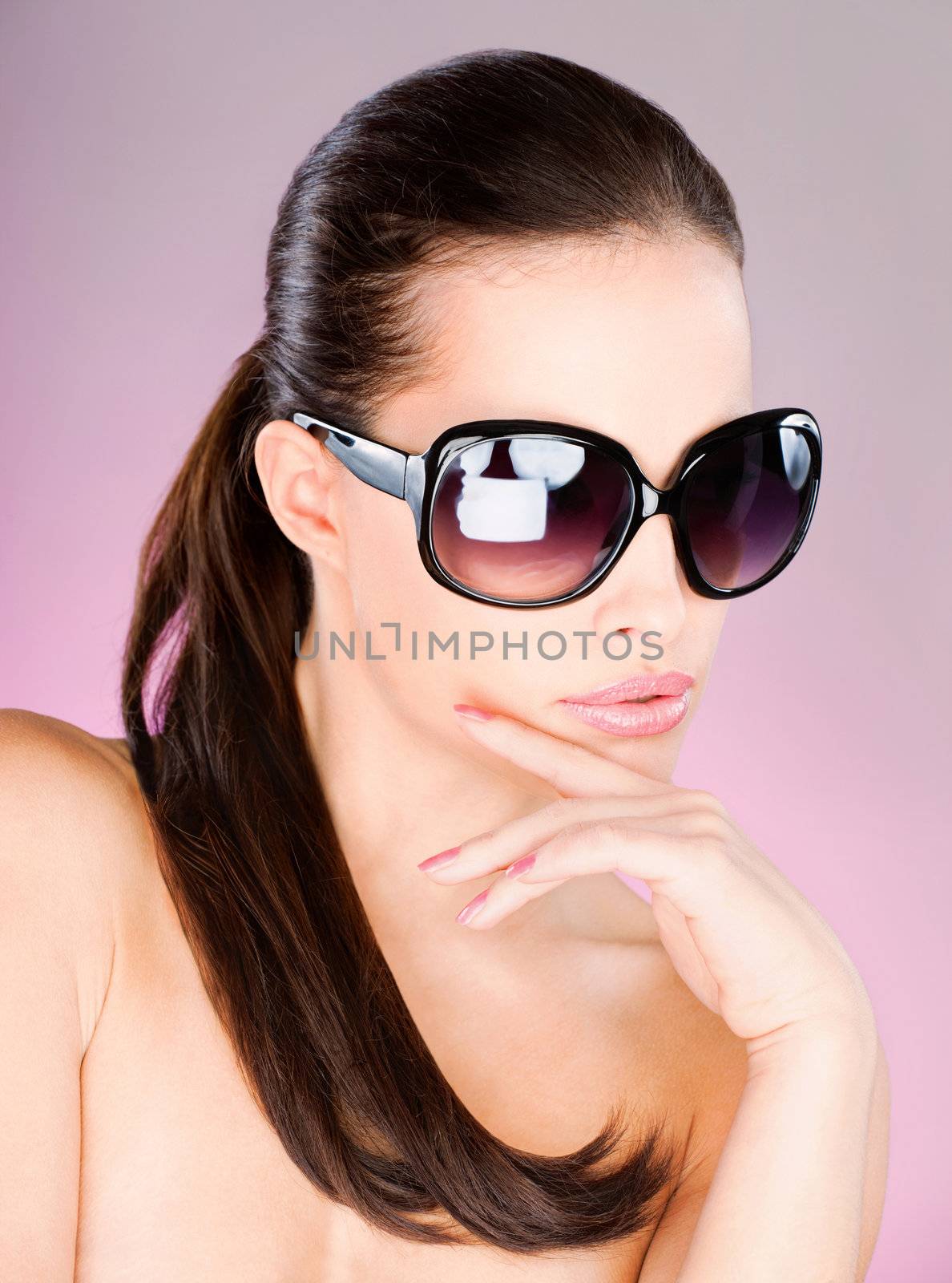 Pretty woman with big black sun glasses