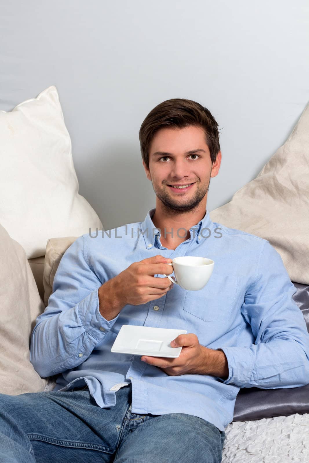 Young man enjoying a coffeebreak by dwaschnig_photo