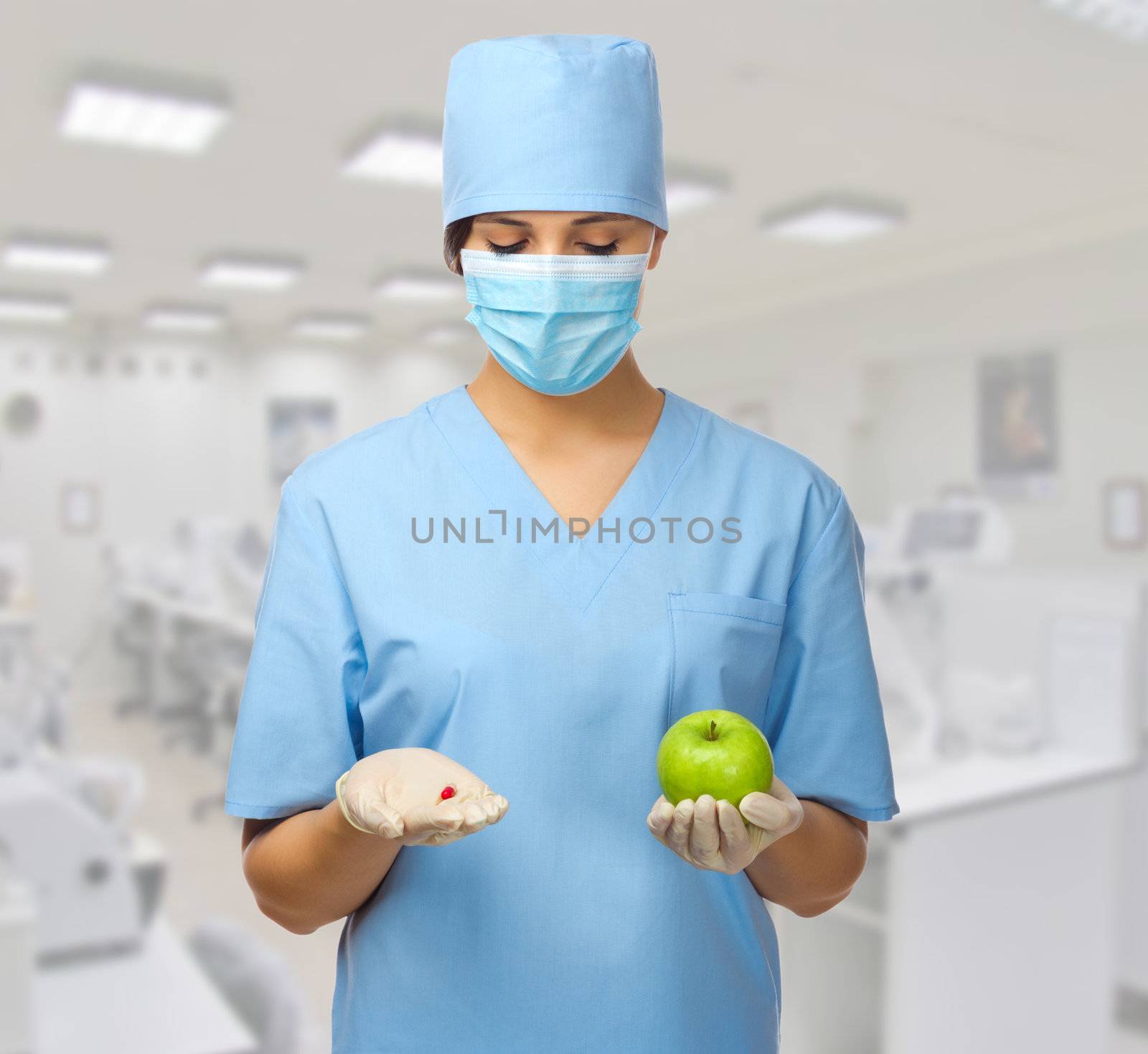 Doctor with pill and apple by rbv