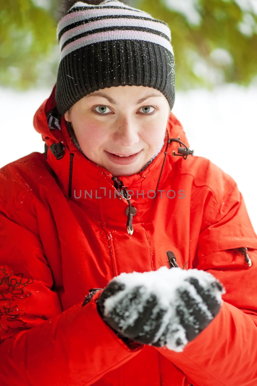 Portrait of a woman who keeps a handful of snow in her hands by kosmsos111