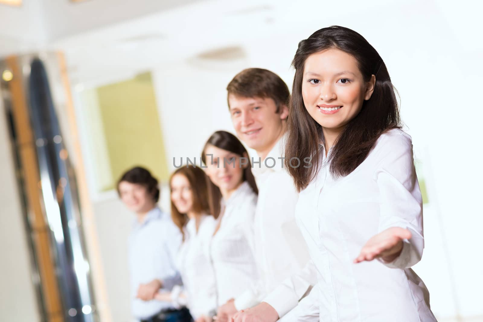 group of people holding hands, woman holds out her hand, the concept of teamwork