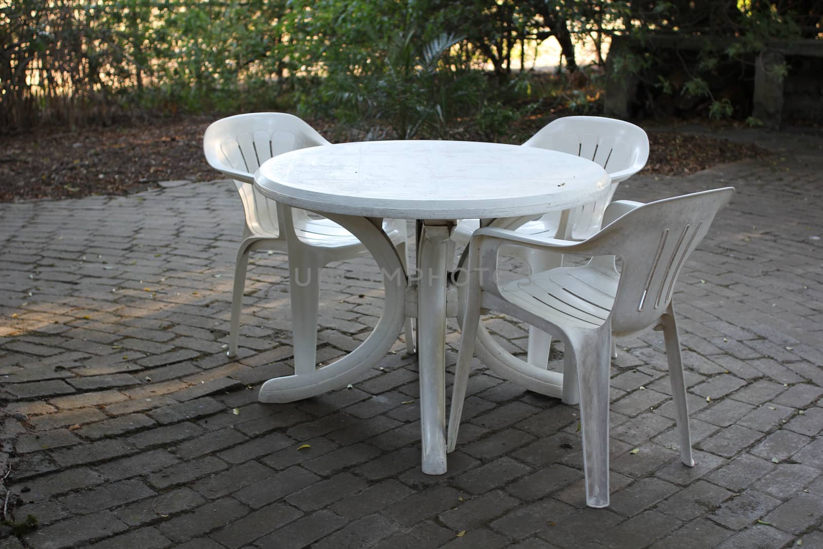 Plastic table with plastic chairs by dwaschnig_photo