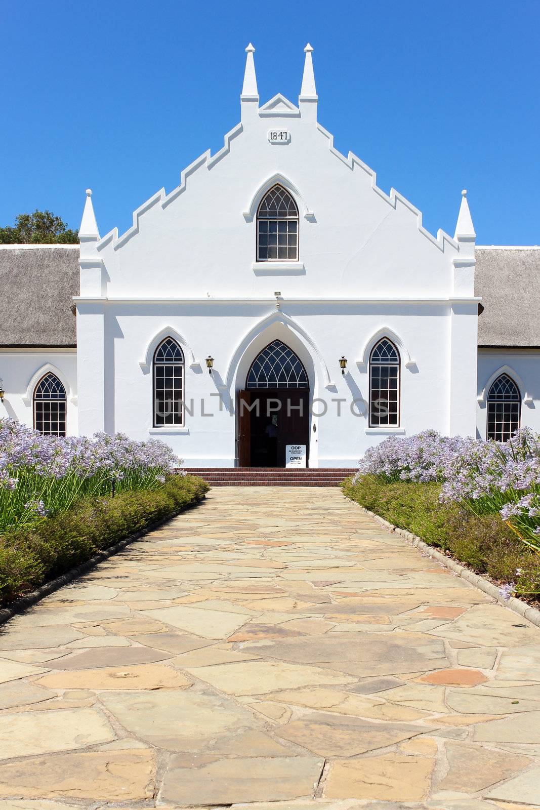 White Church in Franschhoek in front of blue sky by dwaschnig_photo