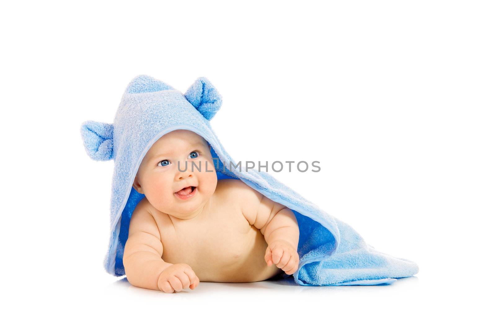 Small smiling baby with a towel