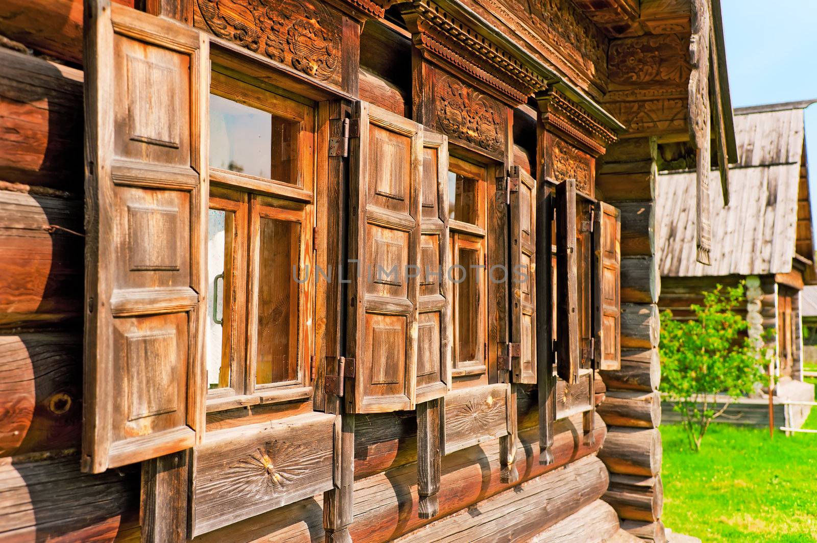 Windows with wooden architraves and shutters