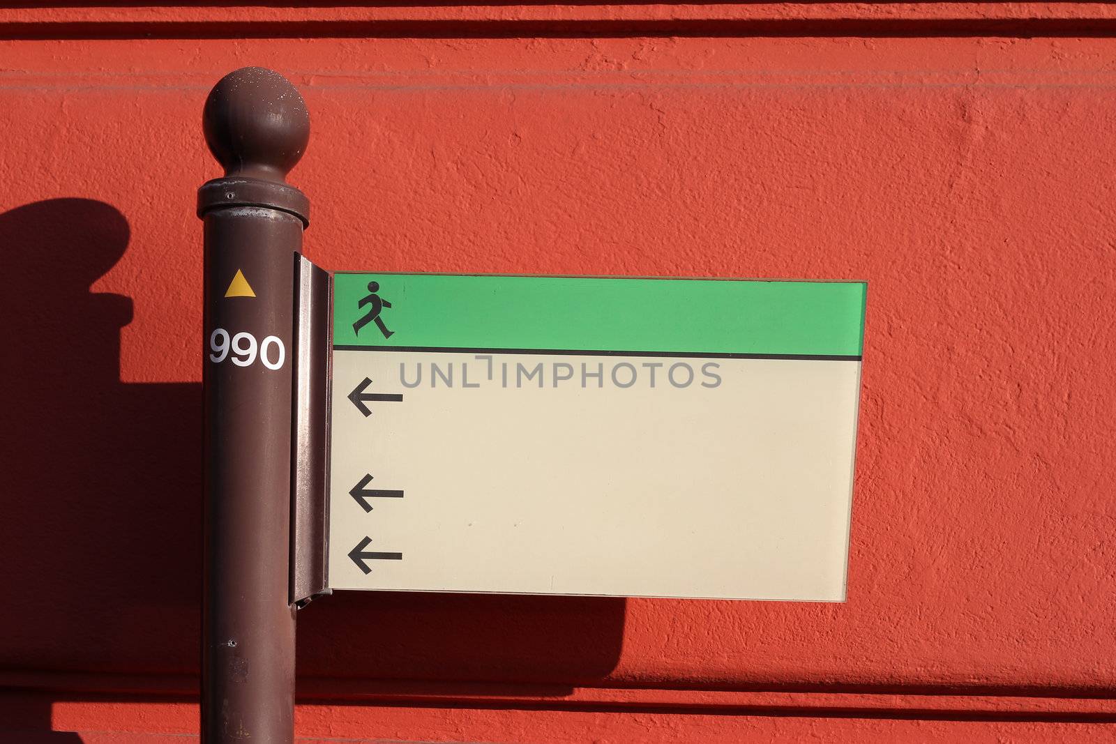 Sign in front of a red wall by dwaschnig_photo