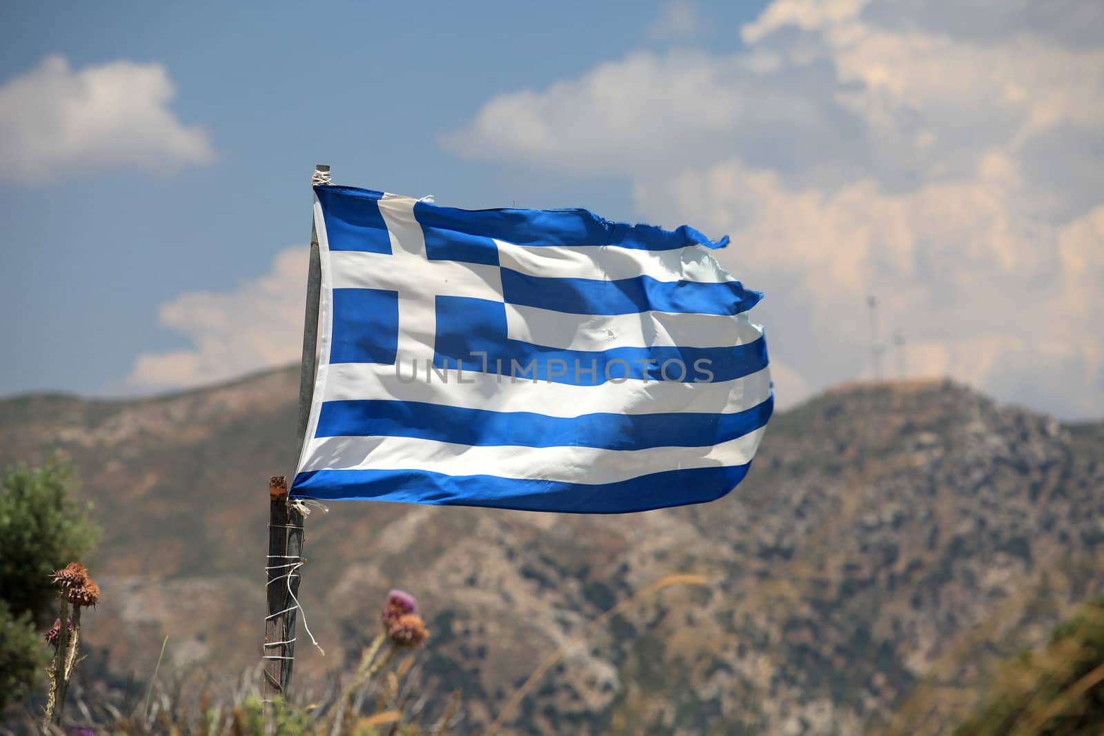 The flag of Greece in a similar state as the economy