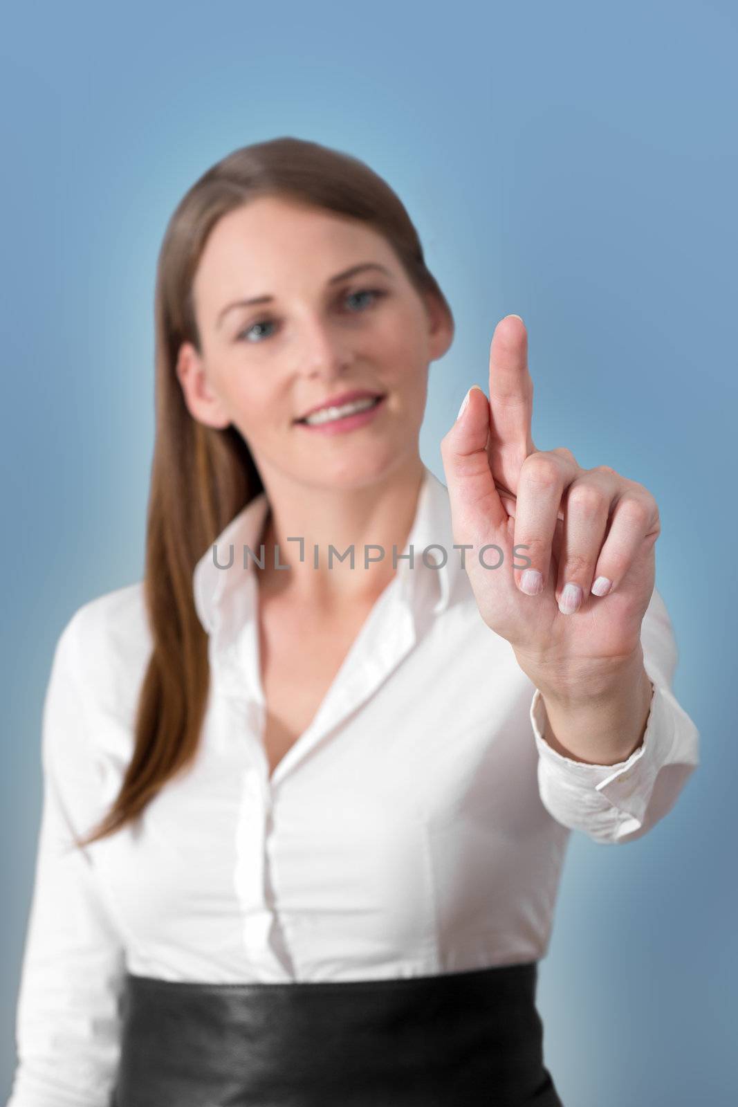 Attractive Brunette Woman Pressing Virtual Button with a light blue background