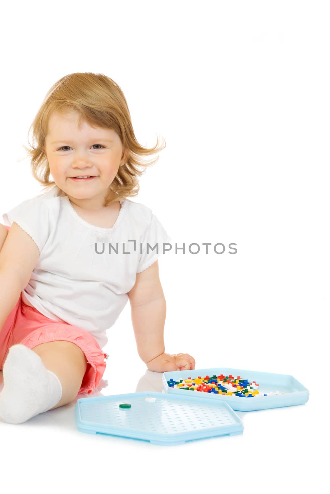 Small girl with toy mosaic isolated