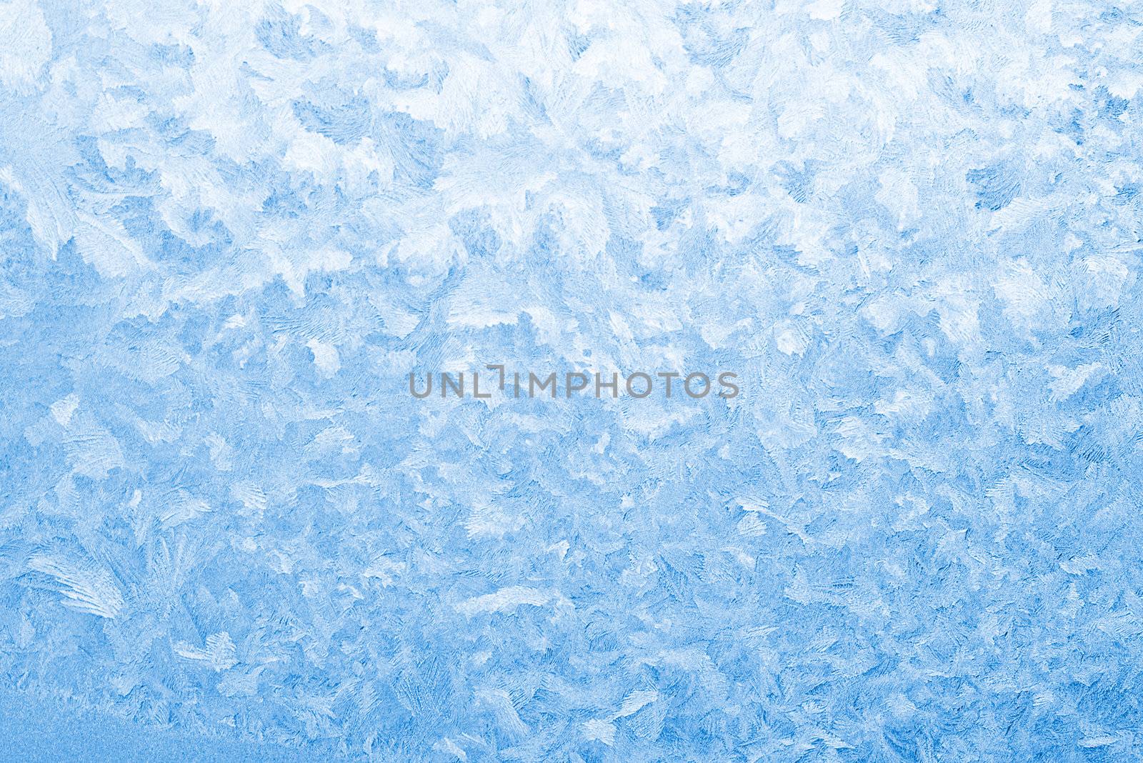 Light blue frozen window glass background