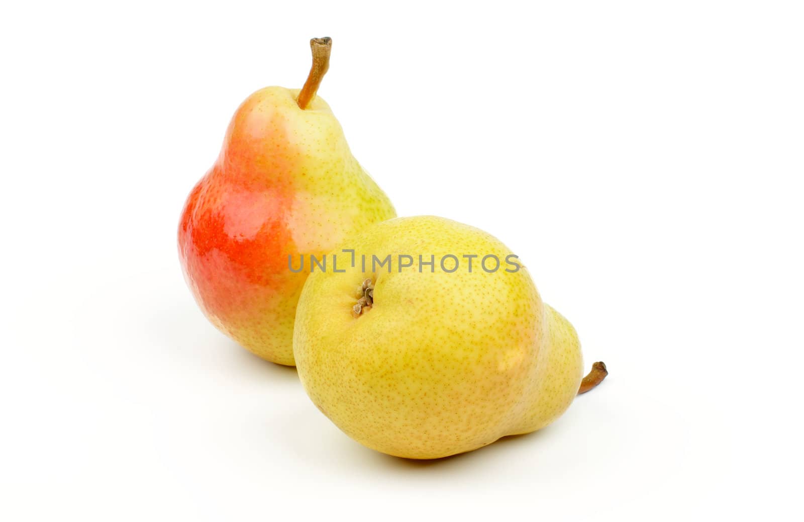Two Perfect Ripe Red and Yellow Pears isolated on white background