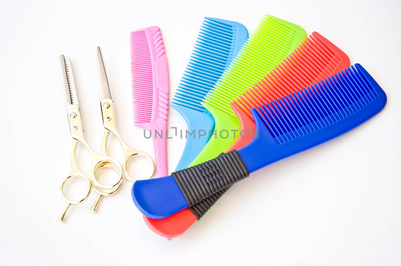 colorful of comb and golden scissor for hairstyle