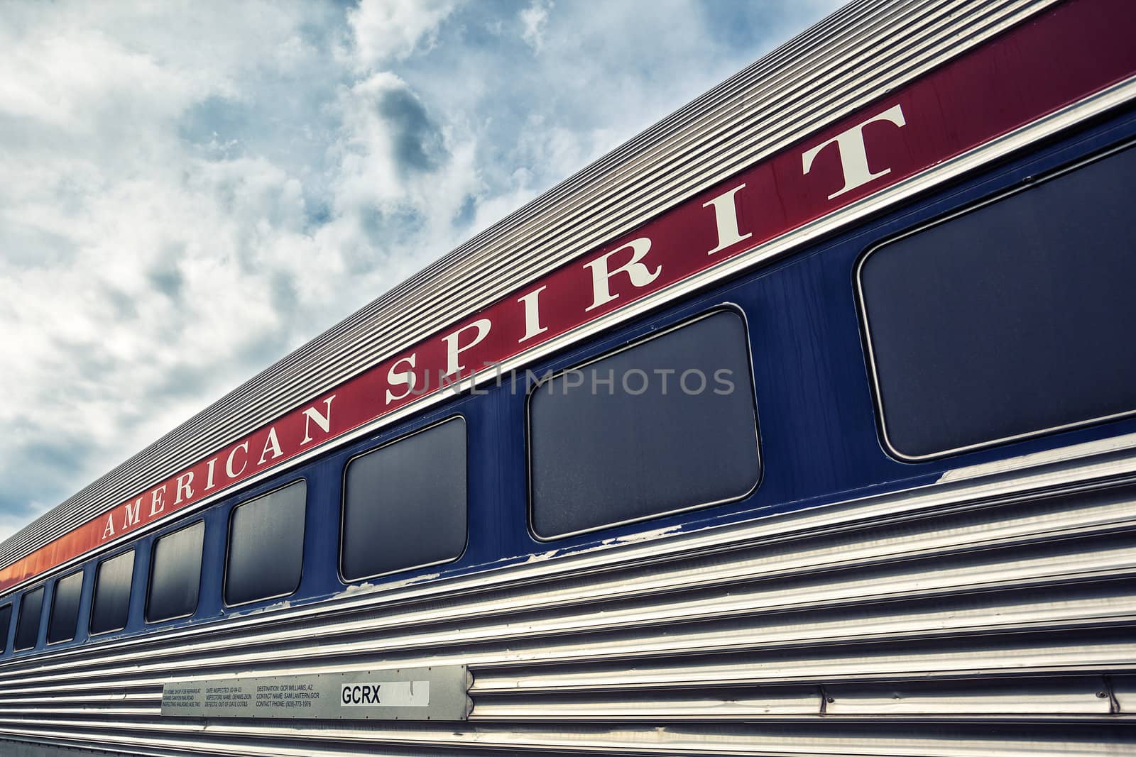 long american train with cloud in the sky