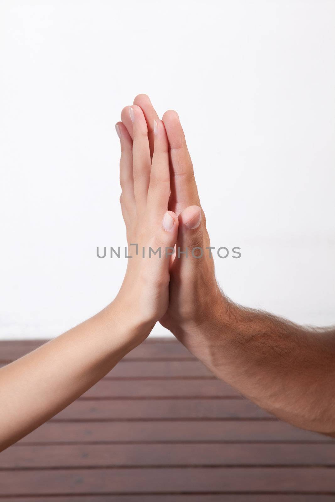 One hand massaged other, indoors .