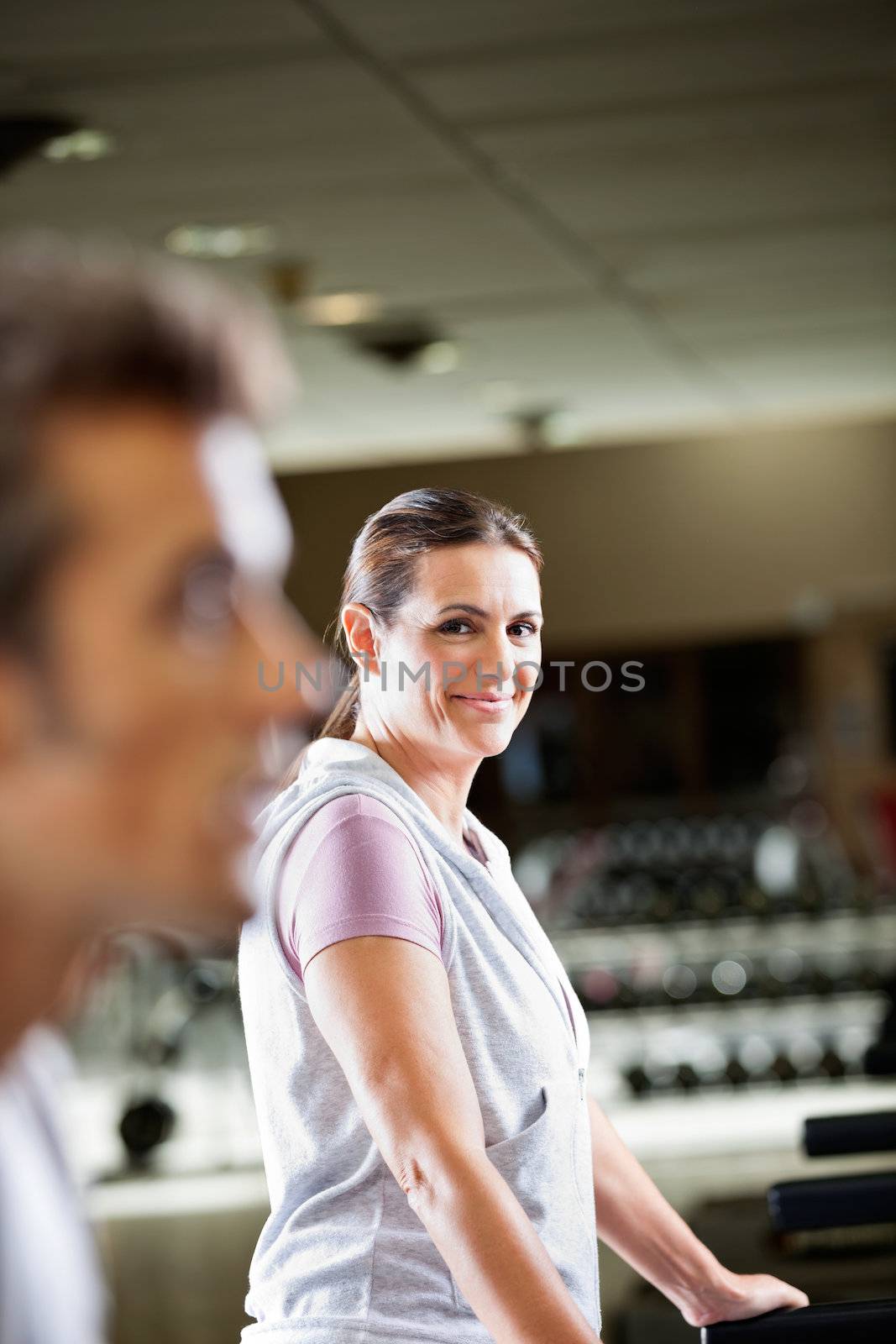 Portrait of mature woman working out at health club
