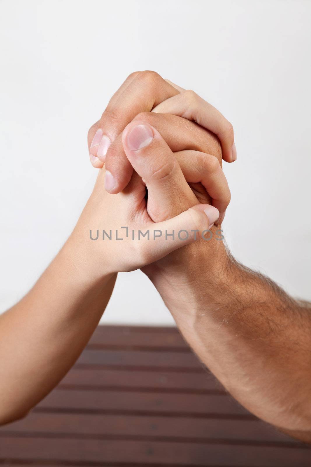 Close up of woman's hand giving a palm acupressure treatment to man