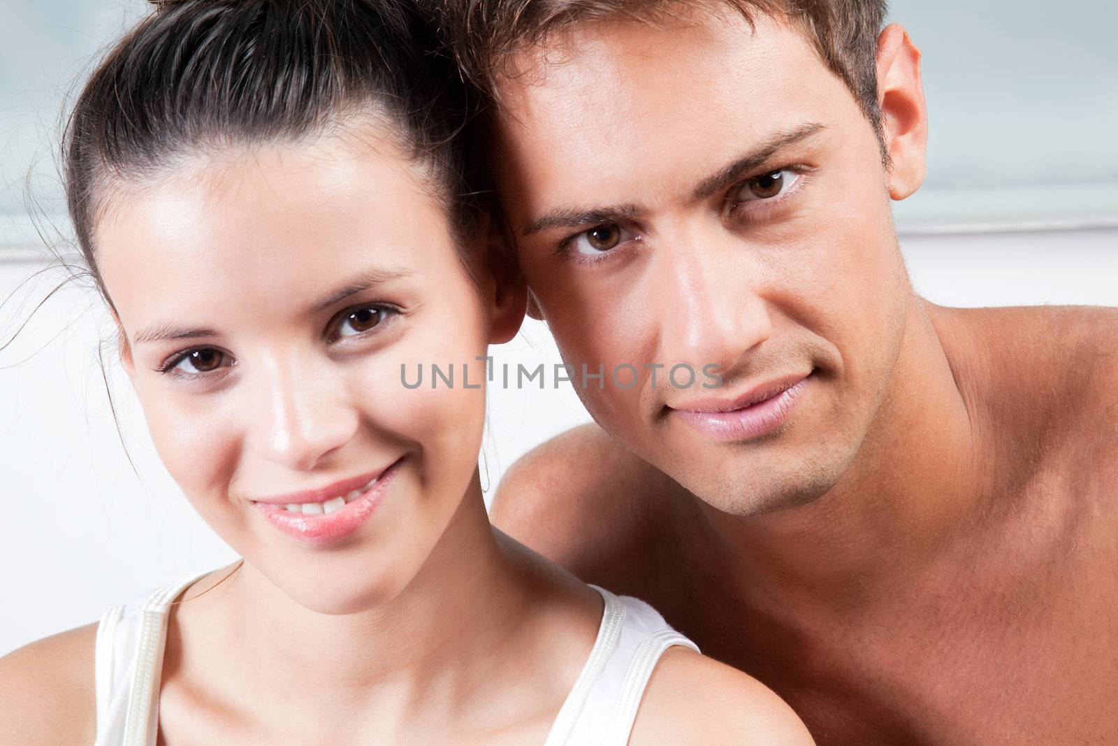 Portrait of young couple side by side.