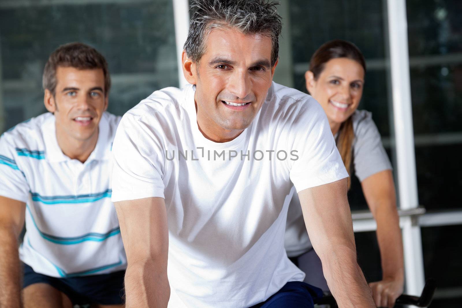 Portrait of happy friends in health club