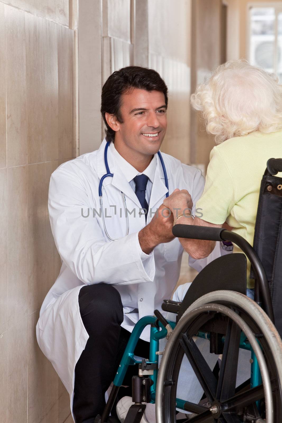Doctor with Patient on Wheel Chair by leaf