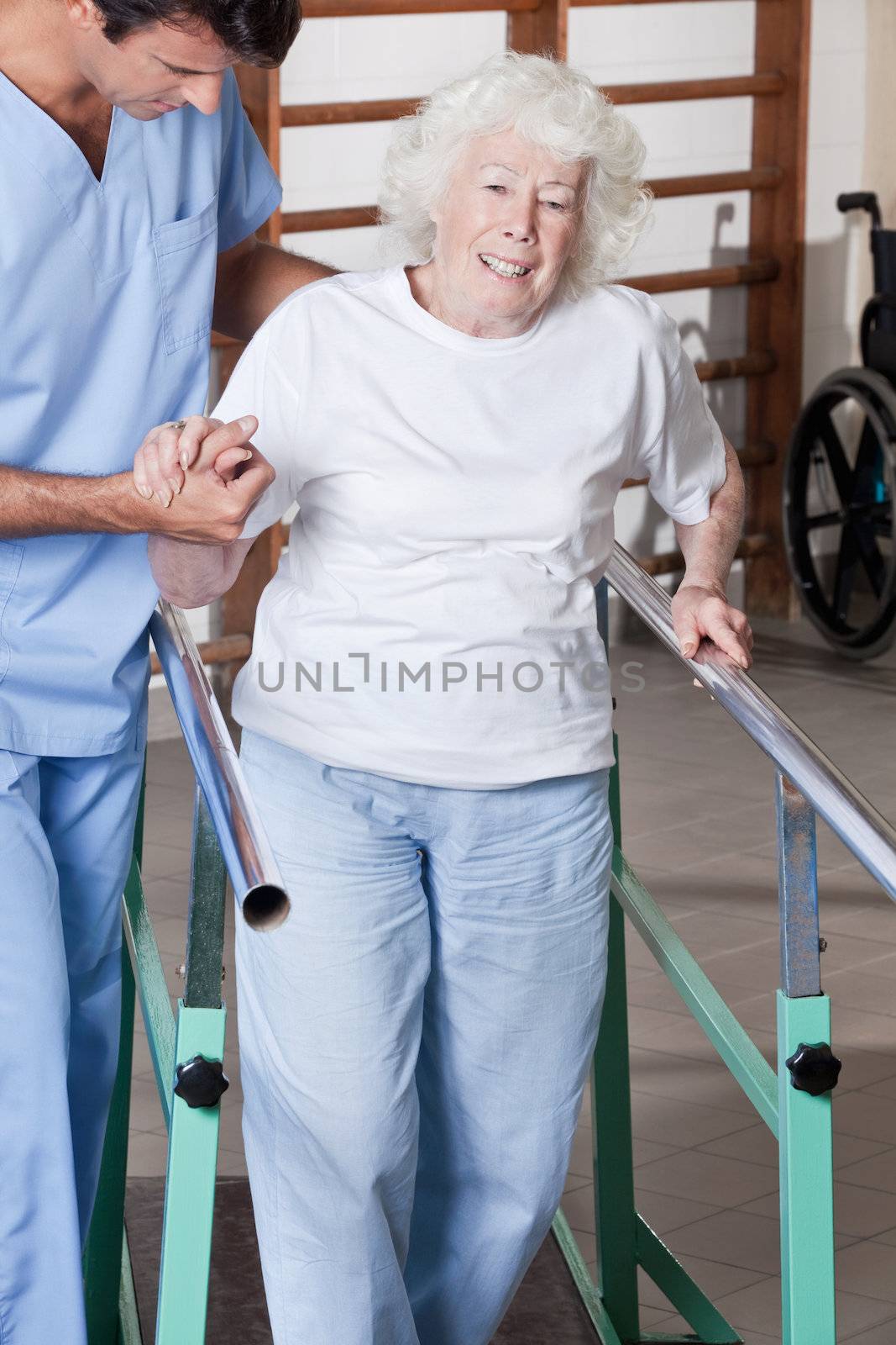 A doctor assisting a senior citizen .