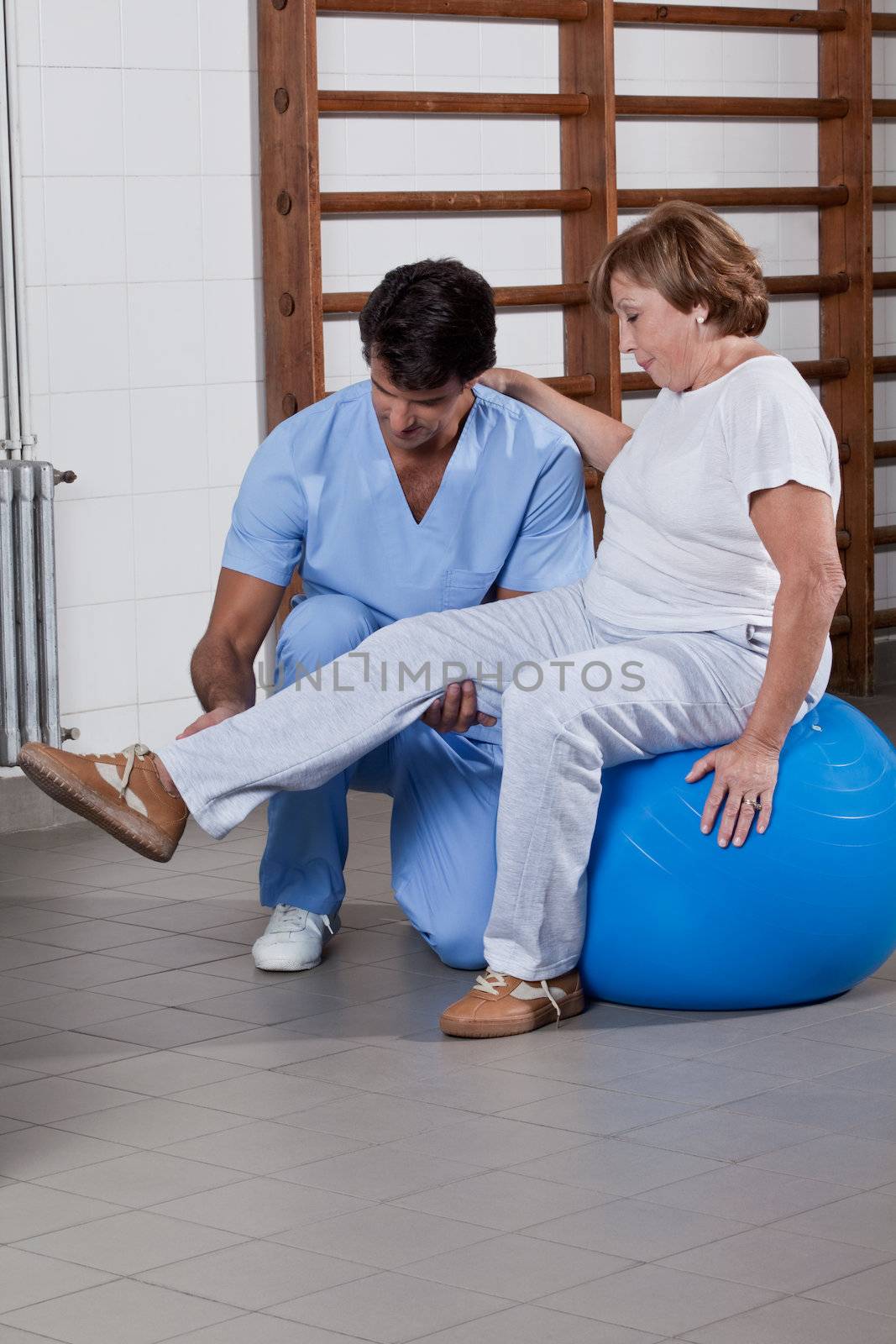 Physical Therapist helping a Patient by leaf