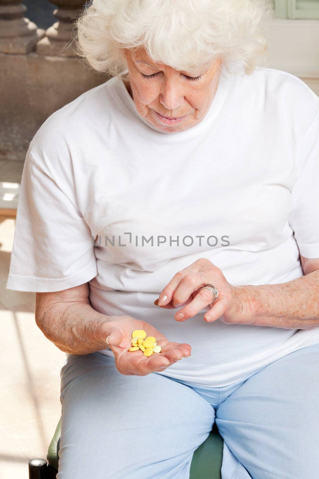 Senior woman looking at tablets