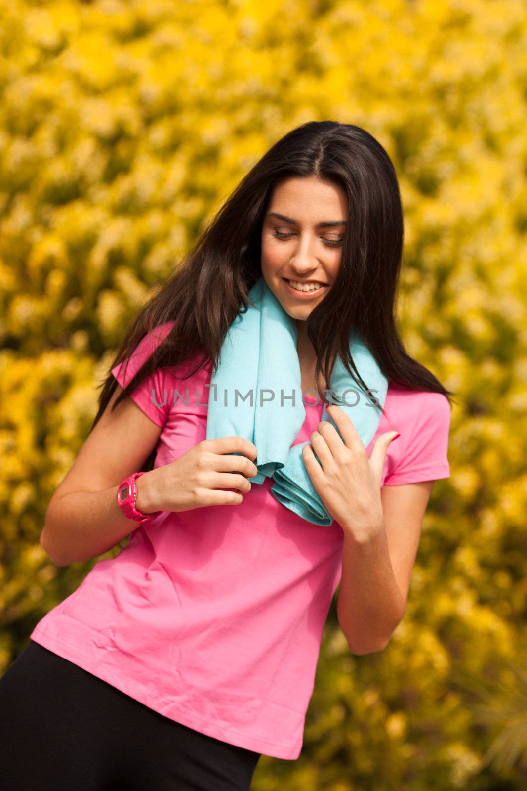 Sport woman with blue towell enjoying after fitness session