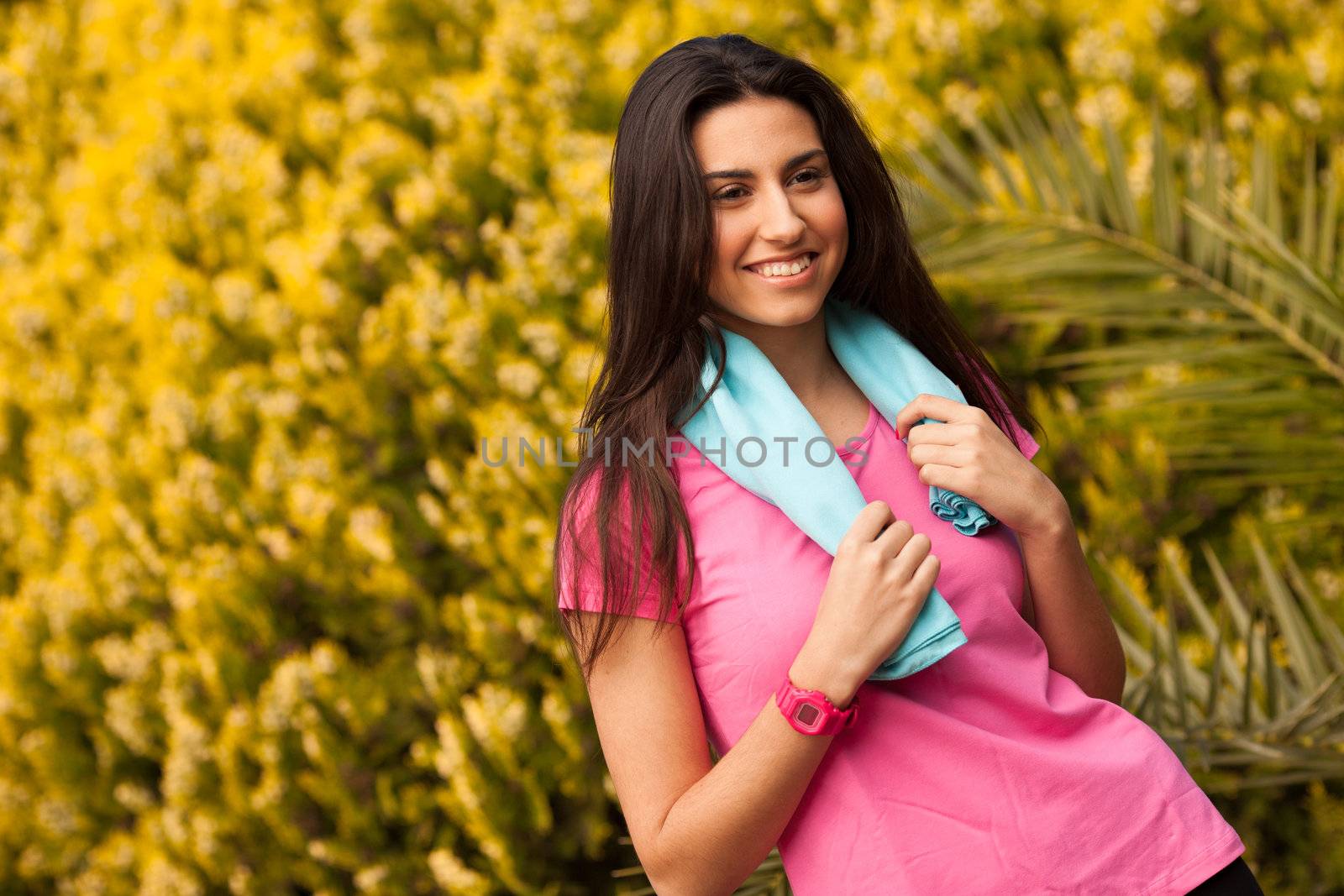 Sport woman with blue towell enjoying after fitness session