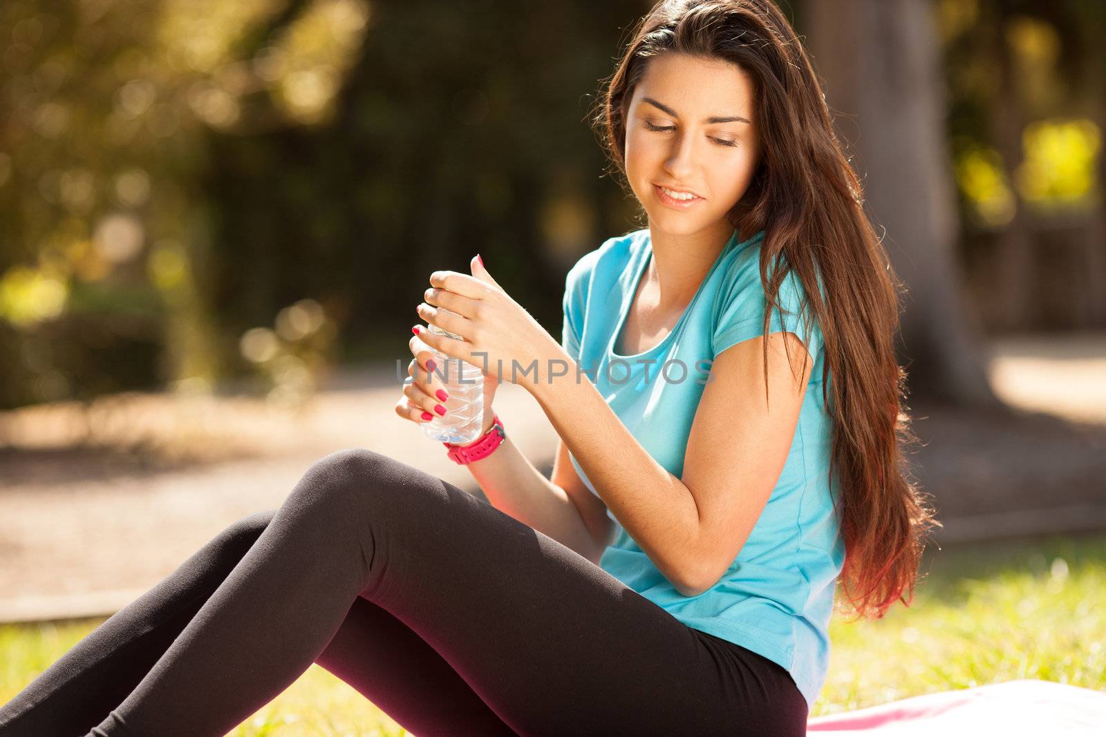 young beautiful sport woman about to drink water by Lcrespi