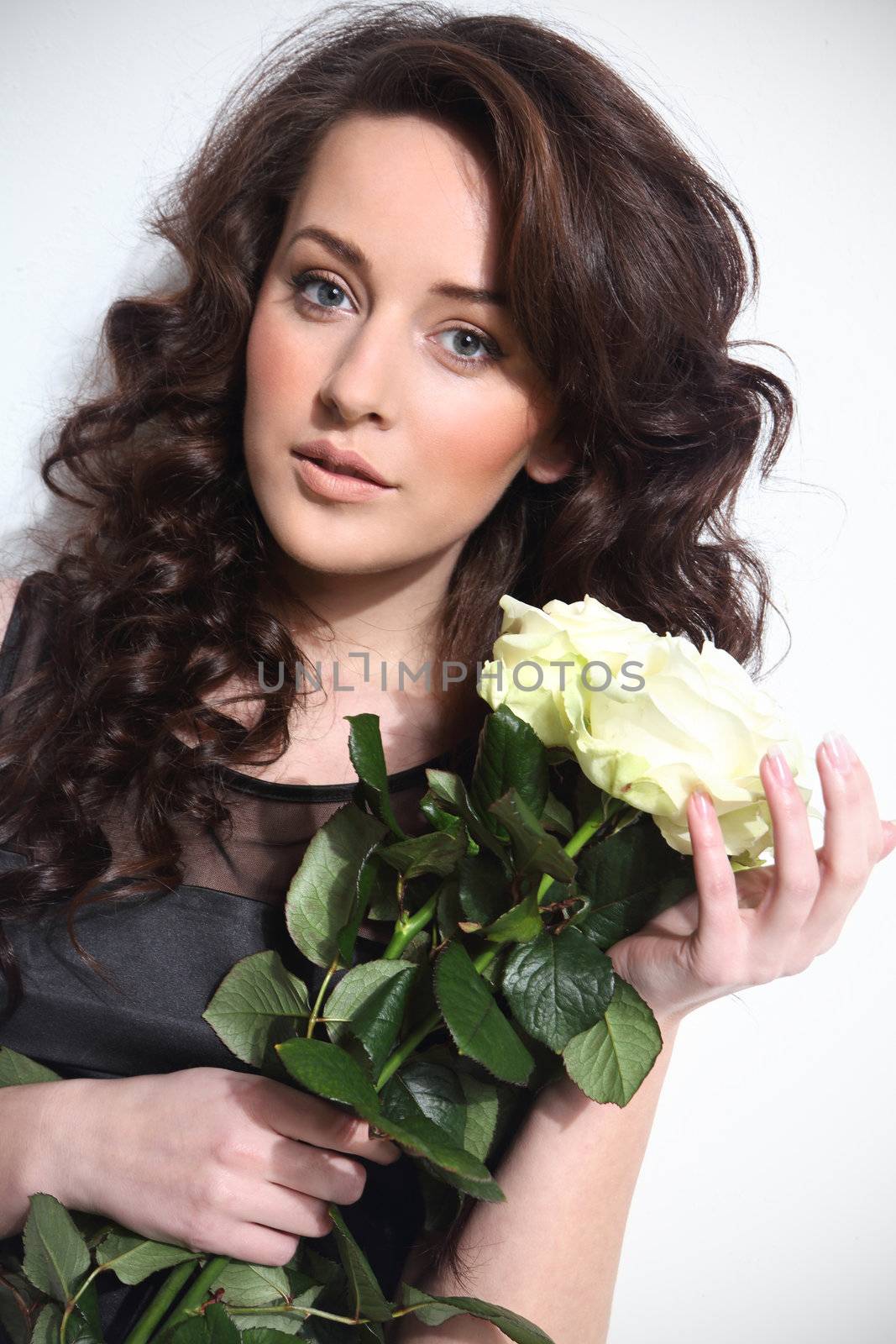 Photo of beautiful woman with white roses by robert_przybysz