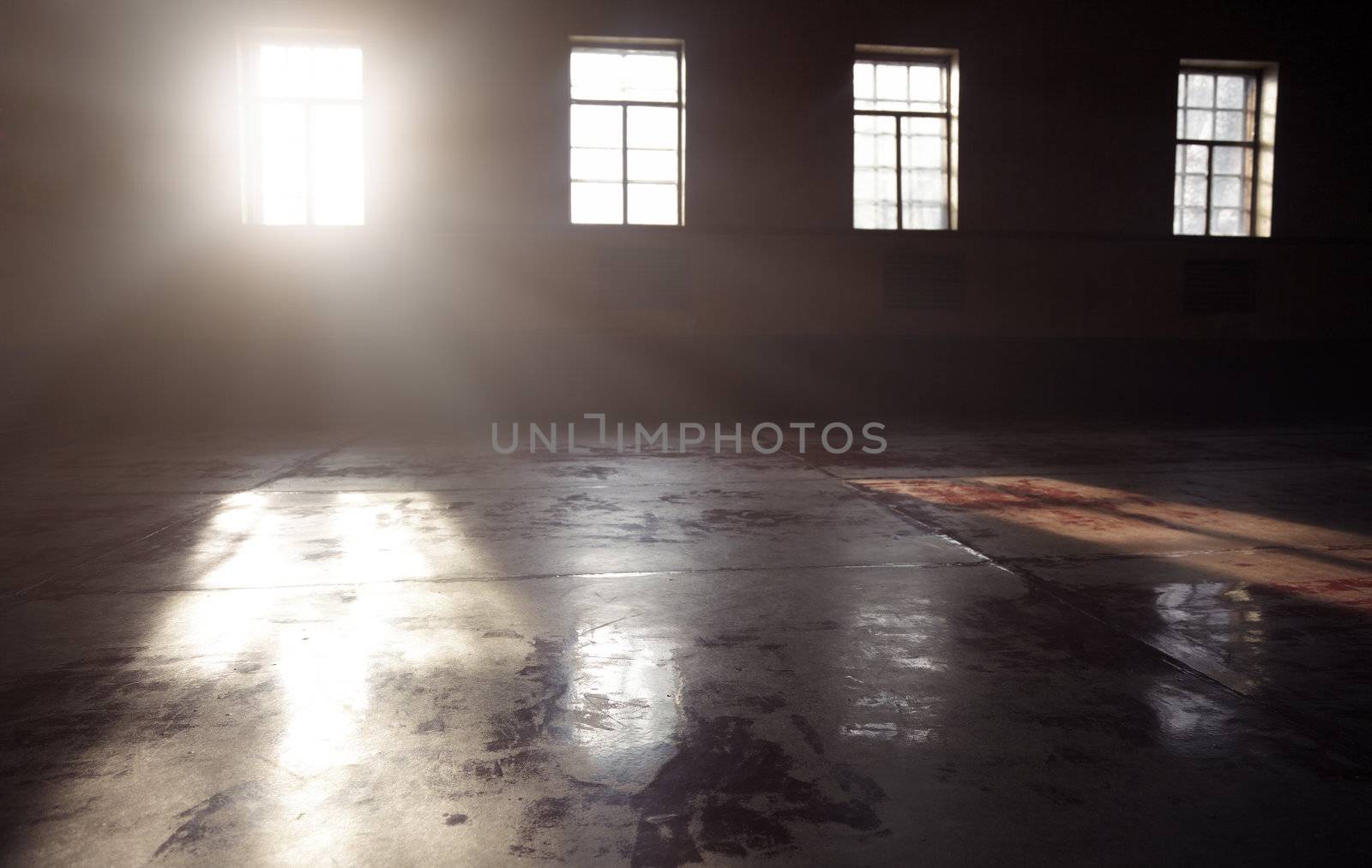 Dark interior with sunlight from the windows