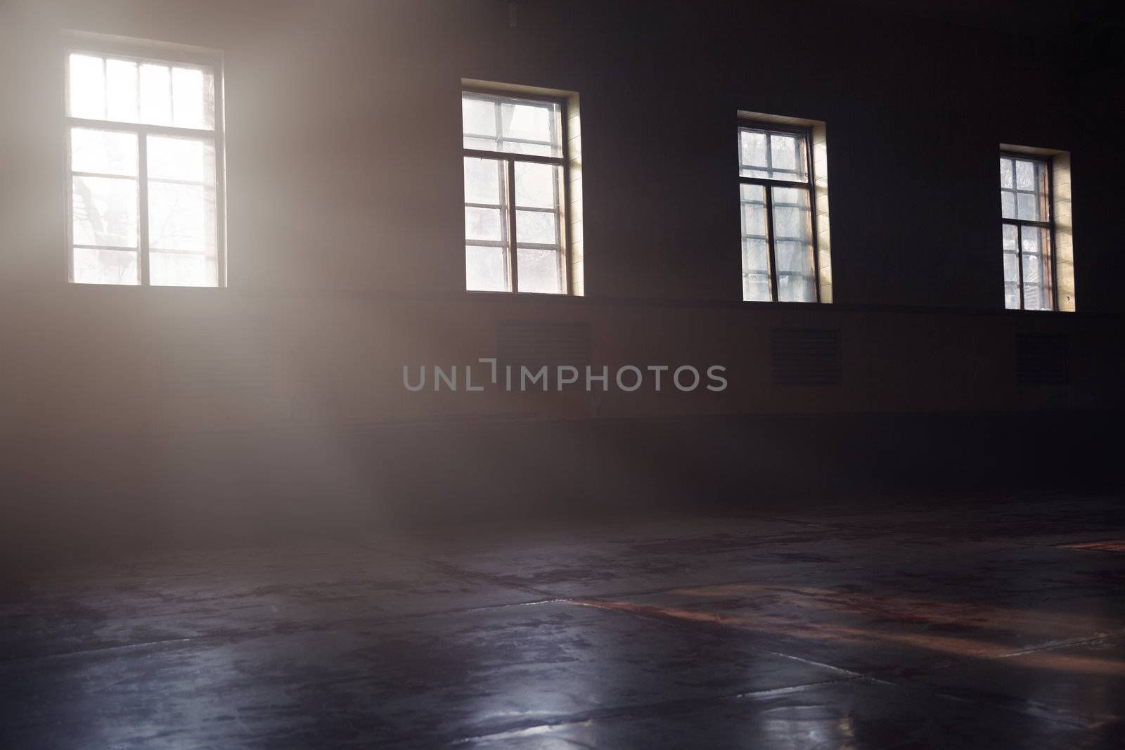 Dark interior with sunlight from the windows