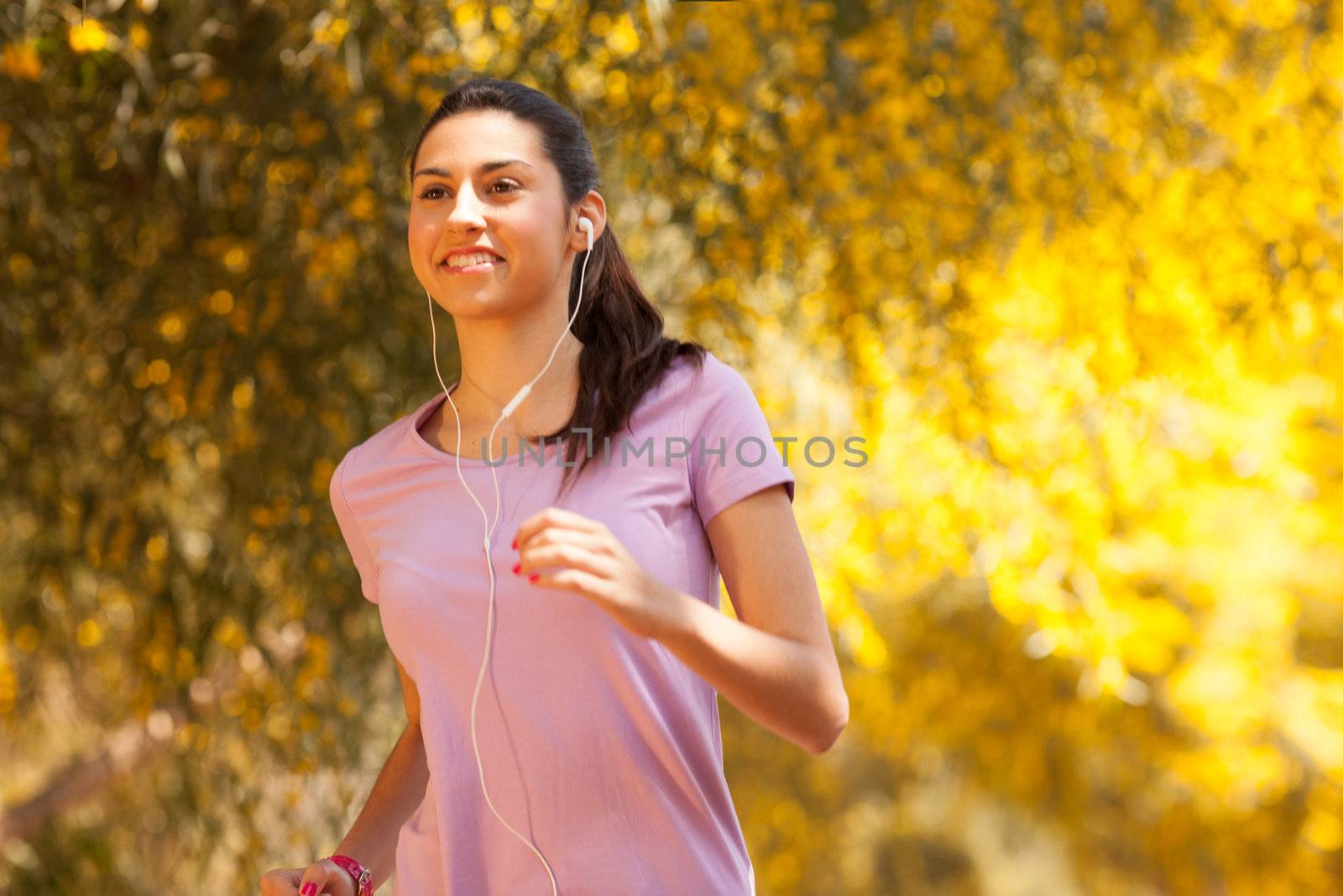 young beautiful woman jogging outdoors