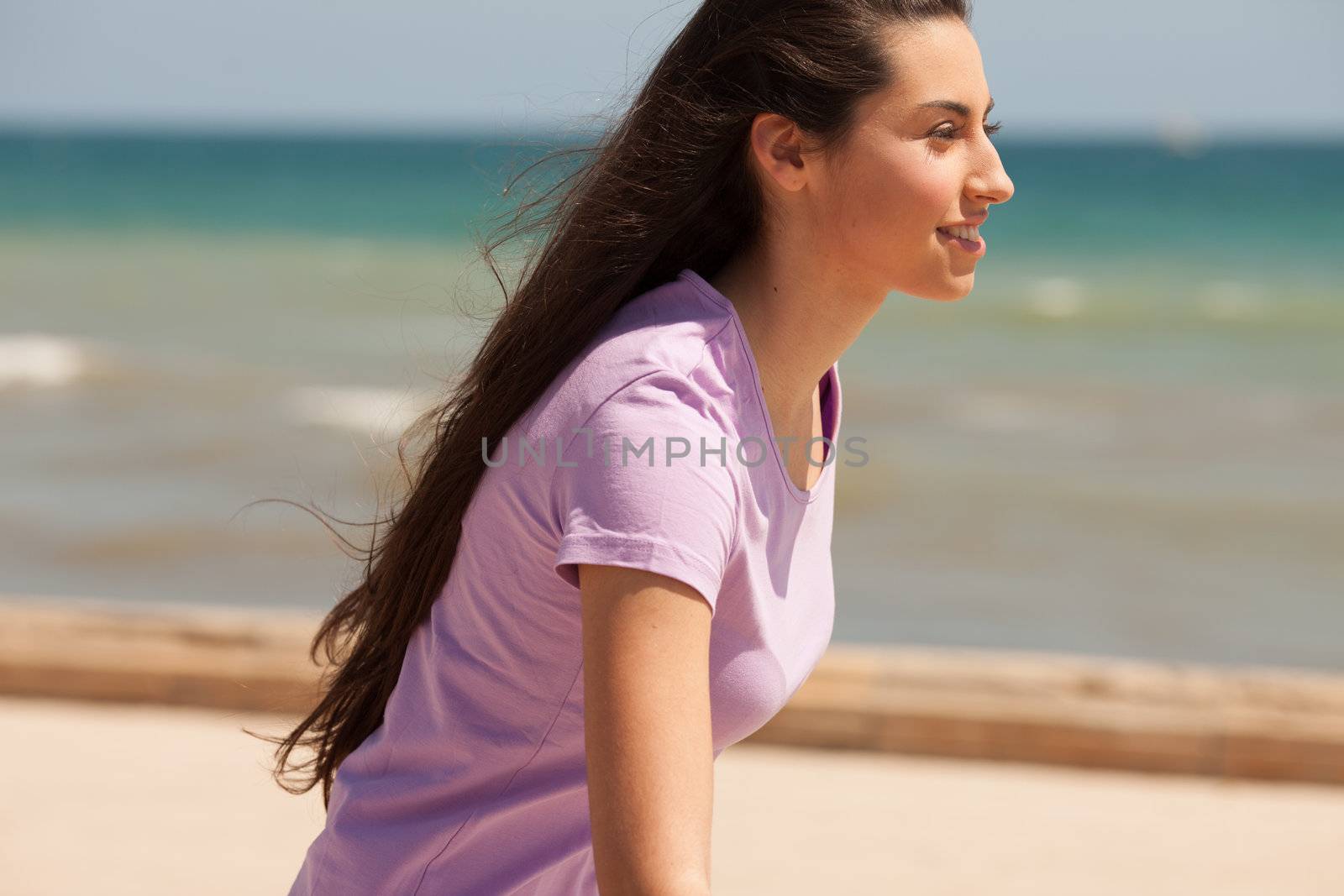 Young beautiful woman portrait with sun flare from above