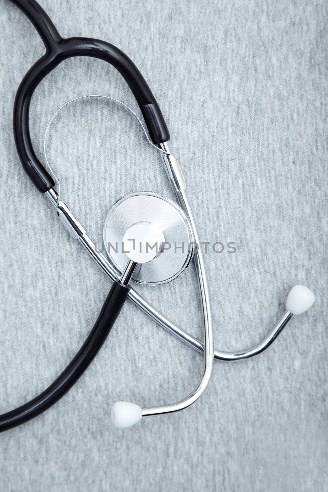 Medical stethoscope on a textured background. Close-up photo