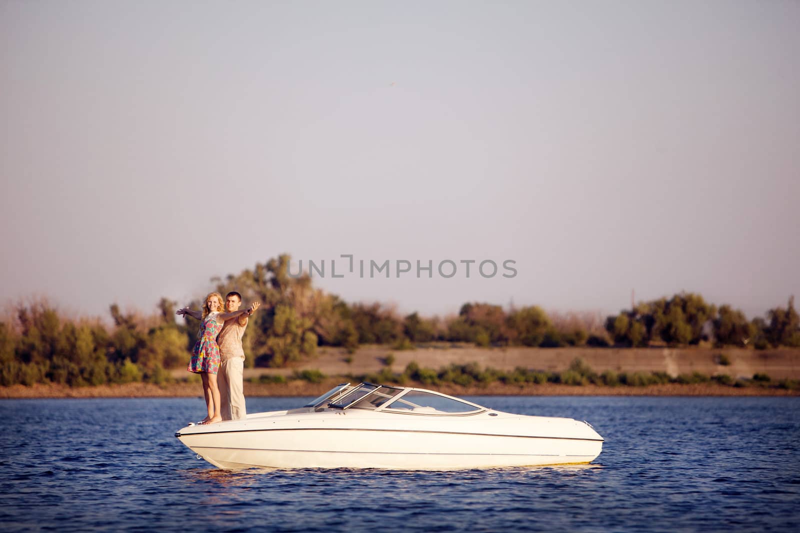 young happy couple on the boat